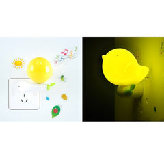 Cute yellow bird plug-in LED night light for bedside illumination.