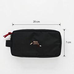 Black embroidered cosmetic travel pouch organizer bag for daily essentials.