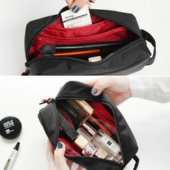 Black embroidered cosmetic travel pouch organizer bag for daily essentials.
