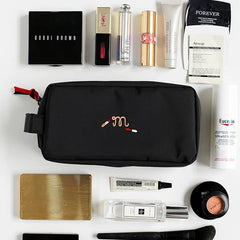 Black embroidered cosmetic travel pouch organizer bag for daily essentials.