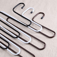 Multi-layer S-shaped metal pants hangers for space-saving closet organization.