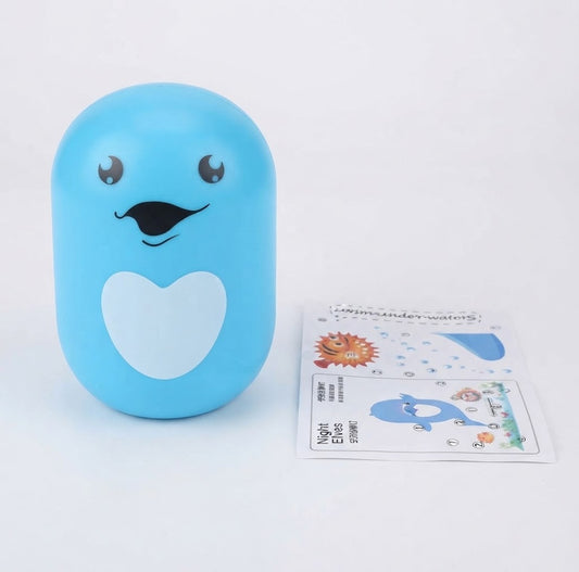 Night Elves Dolphin cartoon plug-in LED night light lamp.