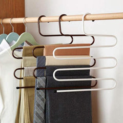 Multi-layer S-shaped metal pants hangers for space-saving closet organization.